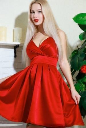 Nice blonde teen Genevieve Gandi removes red dress to display her trimmed muff on realgirlsweb.com
