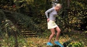 Cute blonde Victoria Pure hikes her skirt to take a pee along country lane on realgirlsweb.com