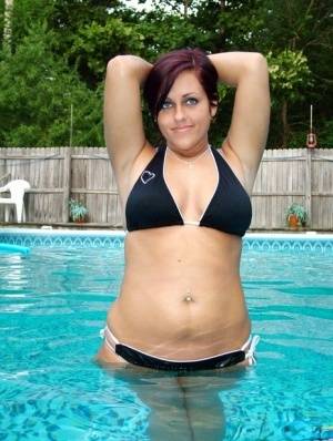 Roxy shows off her her tits in a tiny bikini on realgirlsweb.com