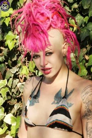 Pink haired tattooed punk girl by the pool on realgirlsweb.com