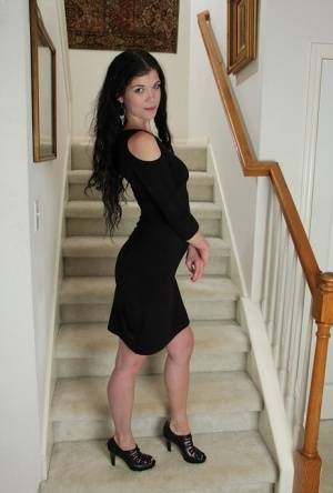 Clothed milf beauty Veronica Stewart is taking off her black dress on realgirlsweb.com