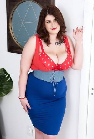 Overweight solo girl Veronica Bow plays with her giant tits while undressing on realgirlsweb.com