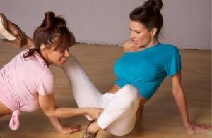 Clothed females Devon Michaels & Veronica Avluv grab crotches in yoga pants on realgirlsweb.com