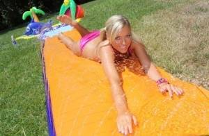Young blonde Ally Kay ends a water fight by having sex in backyard on realgirlsweb.com
