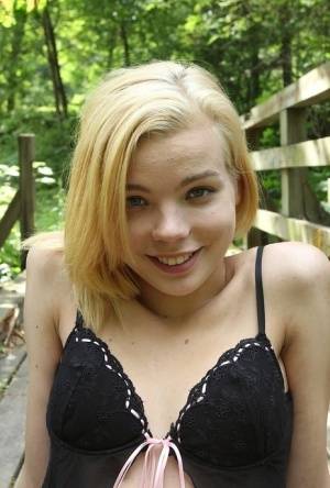 Cute teen amateur Sophia Kitten posing in nude in knee high socks in woods on realgirlsweb.com