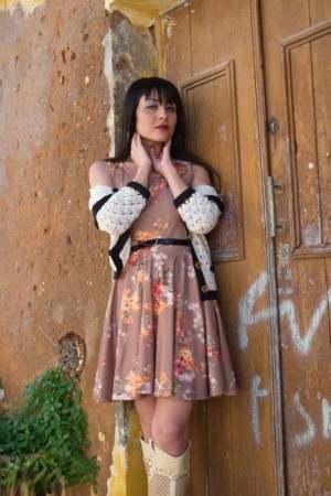 Asian model Sophia Jade flashes her upskirt panties on a cobblestone street on realgirlsweb.com