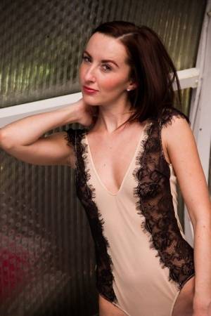 British model Sophia Smith removes a bodysuit to pose nude in purple stockings - Britain on realgirlsweb.com
