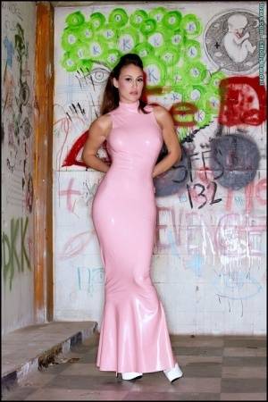 Latina beauty Ryan Keely inserts a vibrator after removing a long latex dress on realgirlsweb.com