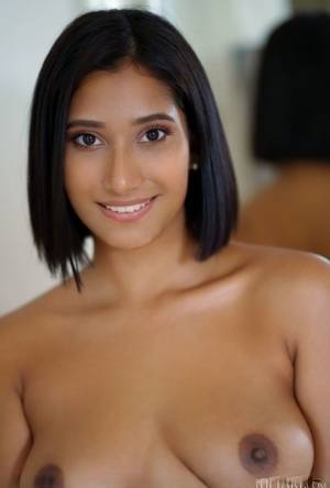 Beautiful Latina teen Alika Penagos gets totally naked on a chair on realgirlsweb.com