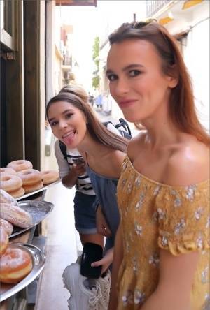 Leggy girls stumble across a donut stand while doing touristy things on realgirlsweb.com