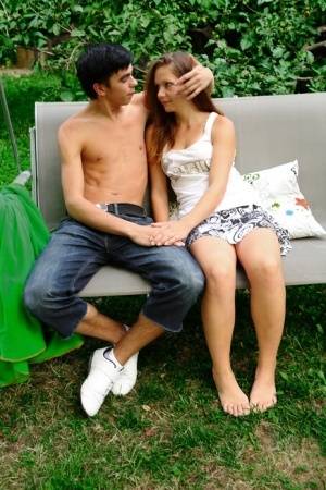 Young amateur receives a facial cumshot after sex on a garden swing on realgirlsweb.com