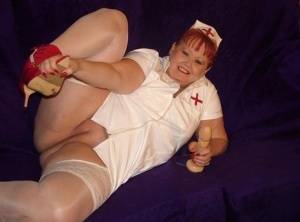 Mature redheaded nurse Valgasmic Exposed exposes herself during dildo play on realgirlsweb.com