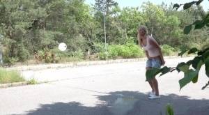 Blonde female Nikki Dream can't hold her pee any longer and squats on roadway on realgirlsweb.com