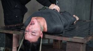 London River is mummified and tied down before being throat fucked in dungeon on realgirlsweb.com