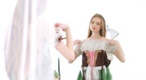 Young beauty Adel Bye dresses in an Oktoberfest outfit to greet her boyfriend on realgirlsweb.com