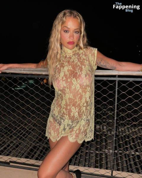 Rita Ora Shows Off Her Nude Boobs While Posing in a Sheer Dress (2 Photos) on realgirlsweb.com